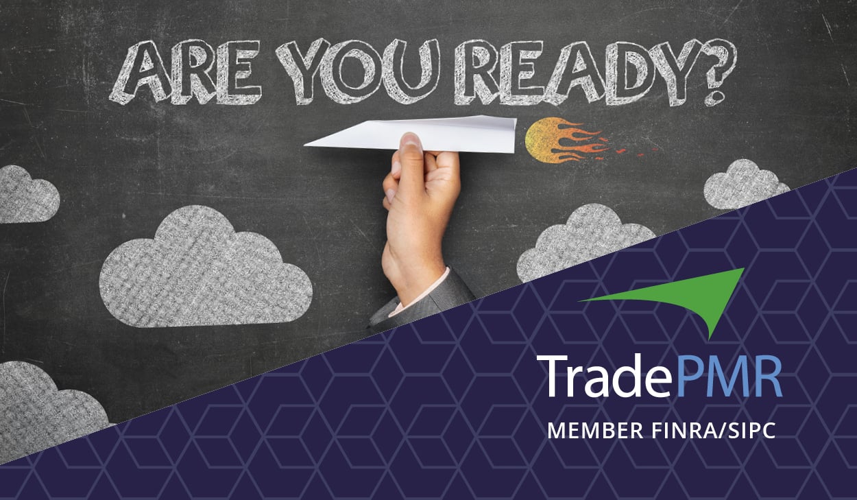 Financial advisor’s hand holding paper airplane in front of chalkboard with words “Are you ready?” referring to custodian mergers. TradePMR logo.